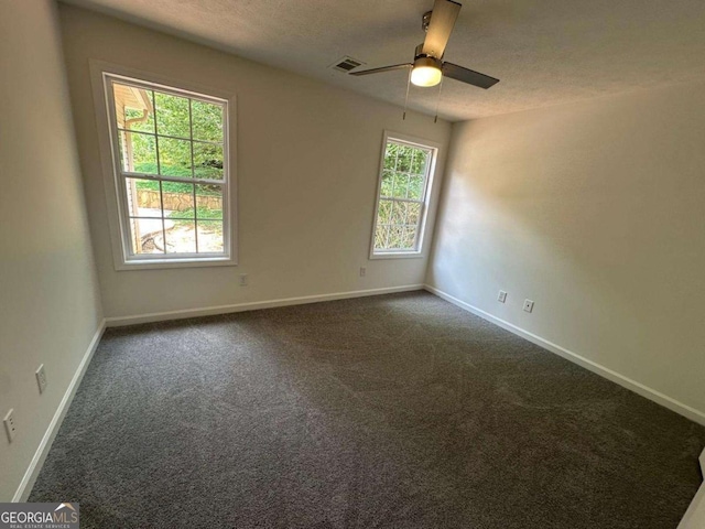 11 Long Branch Xing, Dahlonega, GA 30533 - unfurnished room with dark colored carpet, ceiling fan, and a textured ceiling