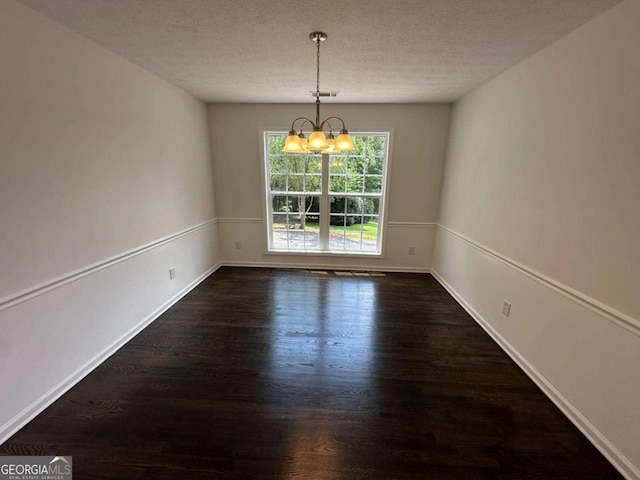 11 Long Branch Xing, Dahlonega, GA 30533 - empty room with a chandelier, wood finished floors, baseboards, and a textured ceiling