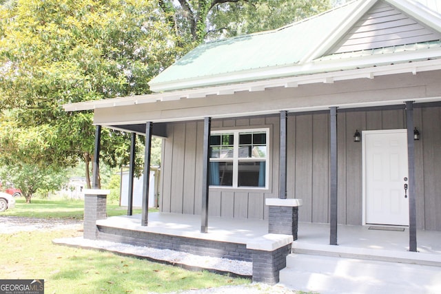1048 Whites Mill Rd, Valley, AL 36854 - property entrance featuring a porch, board and batten siding, and metal roof