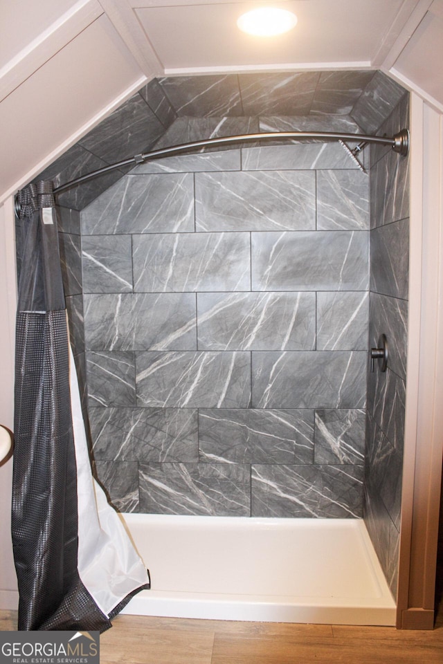 1048 Whites Mill Rd, Valley, AL 36854 - bathroom featuring tiled shower and wood finished floors