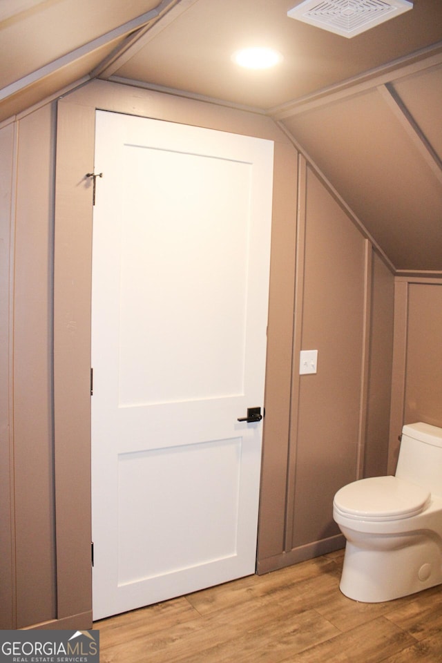 1048 Whites Mill Rd, Valley, AL 36854 - bathroom with toilet, wood finished floors, and lofted ceiling