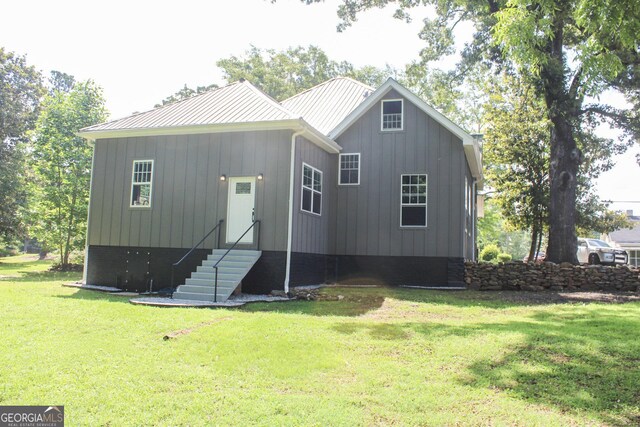 1048 Whites Mill Rd, Valley, AL 36854 - view of front of house with a front yard, entry steps, and board and batten siding
