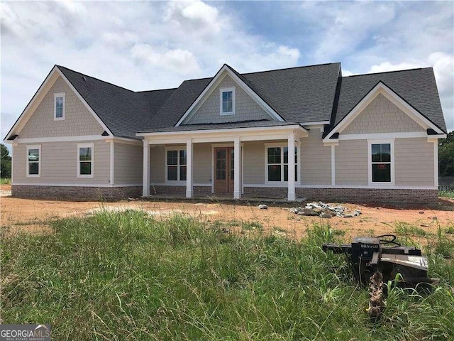 107 Telluride Trl NE, Calhoun, GA 30701 - craftsman inspired home featuring brick siding, a porch, and roof with shingles