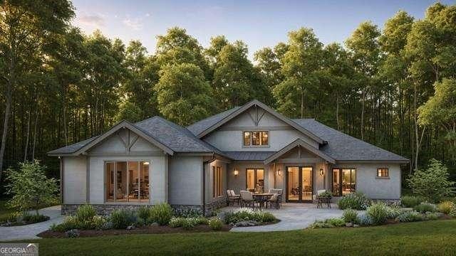 614A E Lake Dr, Gainesville, GA 30506 - back of house at dusk featuring french doors, stucco siding, and a patio area