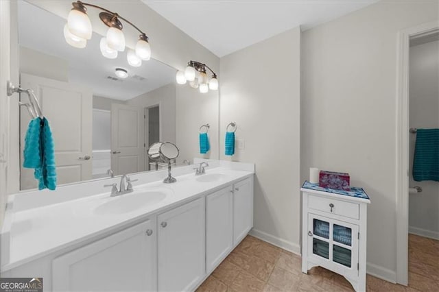 397 Cypher Dr, Suwanee, GA 30024 - bathroom with double vanity and baseboards