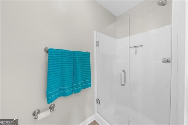 397 Cypher Dr, Suwanee, GA 30024 - full bathroom with a stall shower and baseboards
