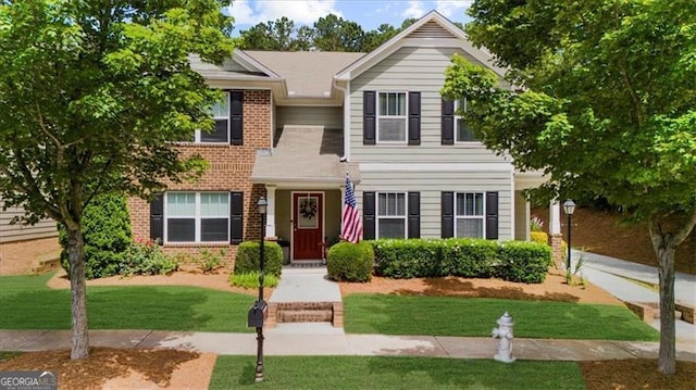 397 Cypher Dr, Suwanee, GA 30024 - view of front of house featuring brick siding and a front lawn