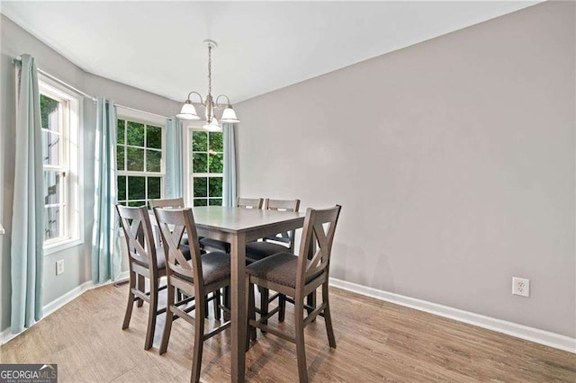 9410 Brooke Cove Ct, Gainesville, GA 30506 - dining space with baseboards, light wood-style floors, plenty of natural light, and a chandelier