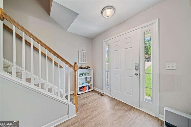 9410 Brooke Cove Ct, Gainesville, GA 30506 - foyer entrance with plenty of natural light, stairs, wood finished floors, and baseboards