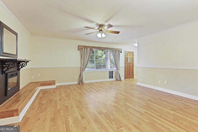 2317 Ga Highway 24, Statesboro, GA 30461 - unfurnished living room featuring ornamental molding, a ceiling fan, and light wood-type flooring