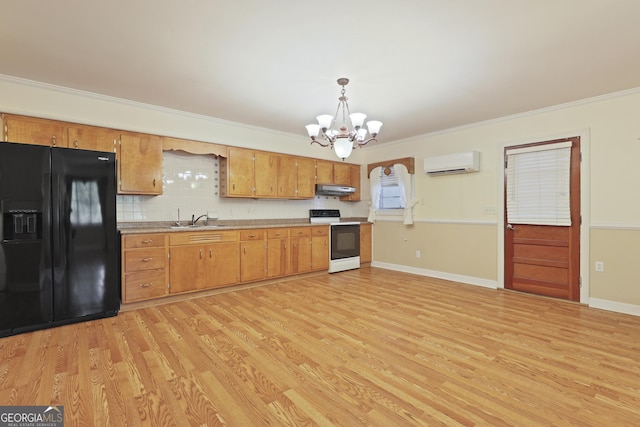 2317 Ga Highway 24, Statesboro, GA 30461 - kitchen featuring black fridge with ice dispenser, electric stove, an AC wall unit, a chandelier, and under cabinet range hood