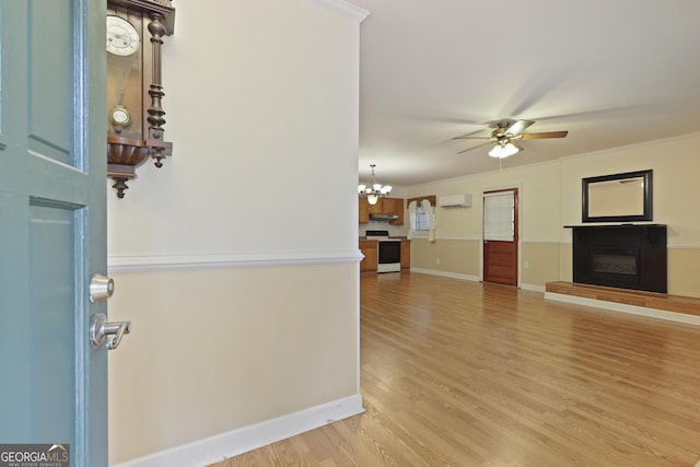 2317 Ga Highway 24, Statesboro, GA 30461 - foyer entrance with a wall unit AC, a ceiling fan, a glass covered fireplace, light wood finished floors, and a chandelier