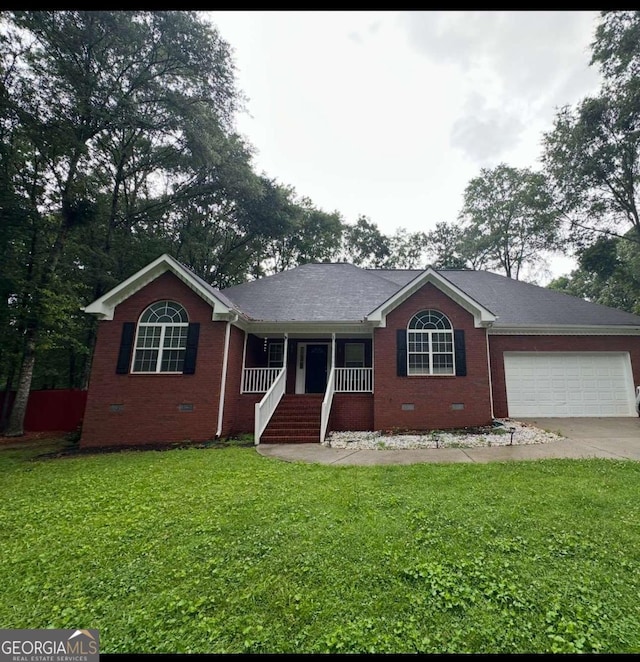 2021 Windfield Dr, Monroe, GA 30655 - ranch-style home featuring crawl space, a porch, brick siding, and driveway