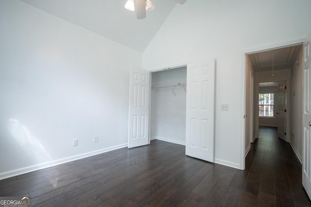 2021 Windfield Dr, Monroe, GA 30655 - unfurnished bedroom with attic access, dark wood-style flooring, high vaulted ceiling, a closet, and a ceiling fan