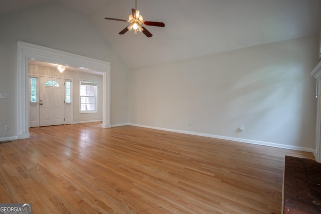 2021 Windfield Dr, Monroe, GA 30655 - unfurnished living room with ceiling fan, light wood-style flooring, and high vaulted ceiling