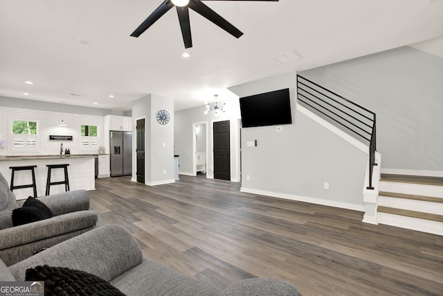 92 Autumn Path, Rockmart, GA 30153 - living room with stairway, ceiling fan, dark wood-style flooring, recessed lighting, and a chandelier