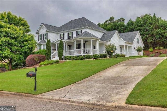 125 Shamus Way, Jefferson, GA 30549 - view of front of home featuring covered porch, a front lawn, concrete driveway, and a ceiling fan