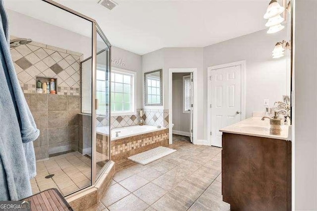 125 Shamus Way, Jefferson, GA 30549 - bathroom featuring a bath, a stall shower, tile patterned floors, and vanity