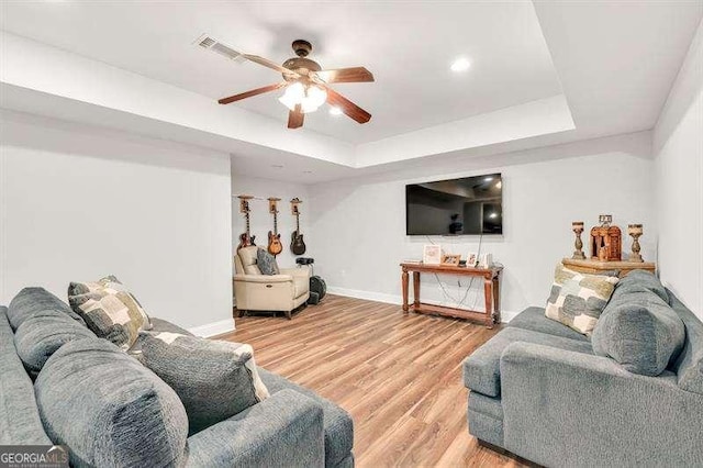 125 Shamus Way, Jefferson, GA 30549 - living area with a ceiling fan, a tray ceiling, light wood-style floors, and recessed lighting