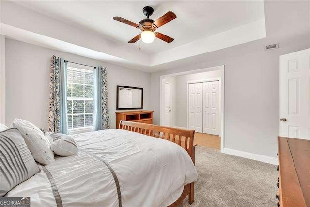 125 Shamus Way, Jefferson, GA 30549 - bedroom with carpet floors, a raised ceiling, a closet, and ceiling fan