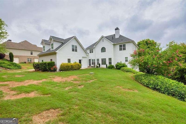 125 Shamus Way, Jefferson, GA 30549 - back of house featuring a lawn and a chimney