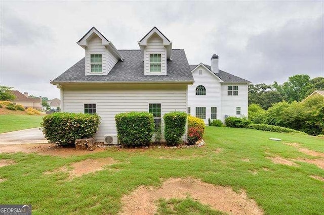 125 Shamus Way, Jefferson, GA 30549 - cape cod house featuring a front lawn, a chimney, and roof with shingles