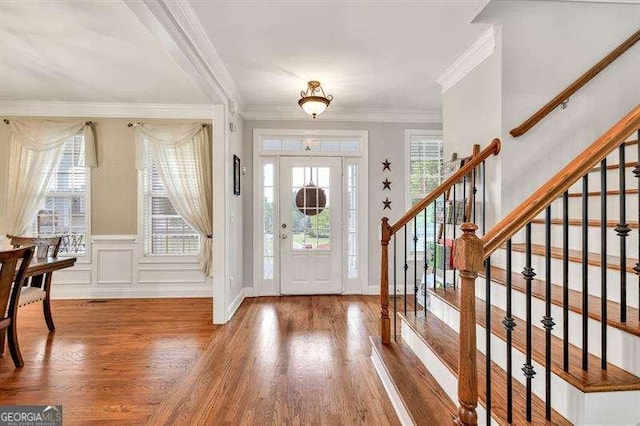 125 Shamus Way, Jefferson, GA 30549 - entrance foyer with stairway, wood finished floors, crown molding, and wainscoting