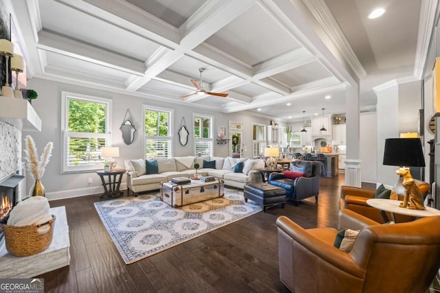 3111 Old Thompson Mill Rd, Buford, GA 30519 - living room with dark wood-style flooring, a fireplace, a ceiling fan, beamed ceiling, and coffered ceiling
