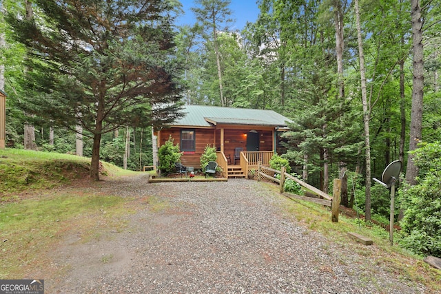 242 Eagles Nest Rd, Sautee Nacoochee, GA 30571 - chalet / cabin with a porch, gravel driveway, and metal roof