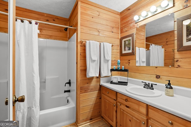 242 Eagles Nest Rd, Sautee Nacoochee, GA 30571 - full bath featuring wooden walls, vanity, shower / bath combination with curtain, a textured ceiling, and tile patterned floors