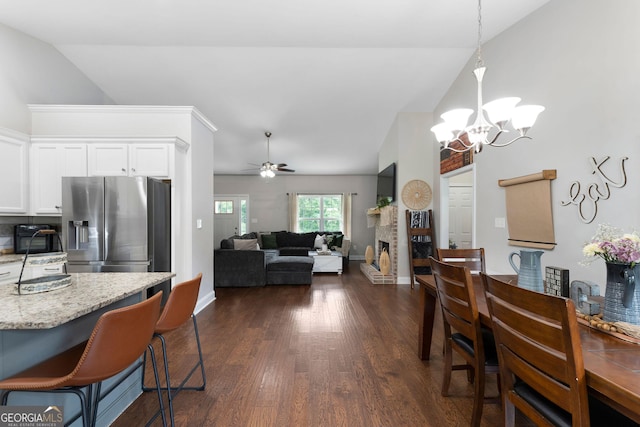 521 Peeples Valley Rd NW, Cartersville, GA 30121 - dining room with dark wood-type flooring, a chandelier, ceiling fan, and high vaulted ceiling