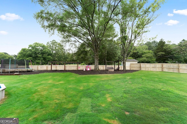 521 Peeples Valley Rd NW, Cartersville, GA 30121 - fenced backyard featuring a trampoline