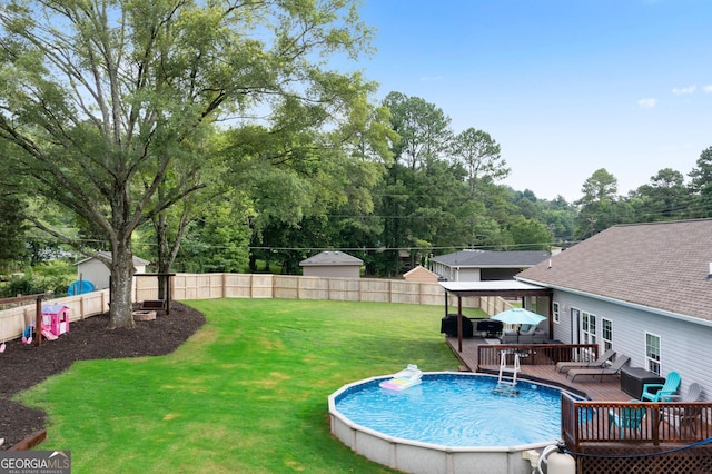521 Peeples Valley Rd NW, Cartersville, GA 30121 - view of swimming pool with a wooden deck, a fenced backyard, and grilling area