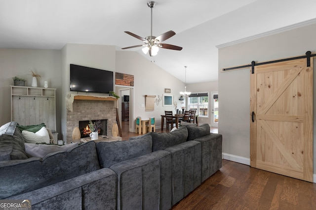 521 Peeples Valley Rd NW, Cartersville, GA 30121 - living area with a barn door, dark wood-style flooring, a ceiling fan, a brick fireplace, and high vaulted ceiling