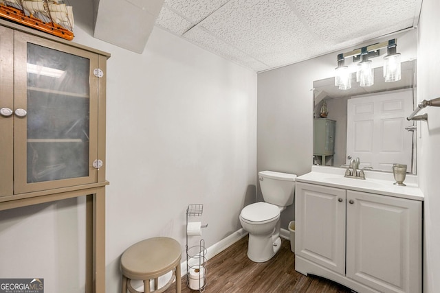 4290 Inverness Ct NE, Roswell, GA 30075 - half bathroom with vanity, wood finished floors, and a drop ceiling
