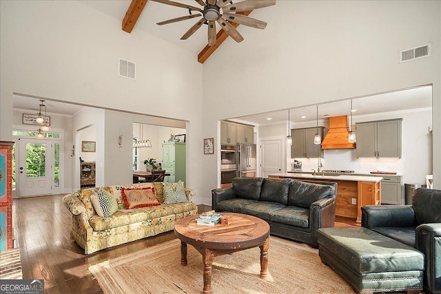 1069 Dean Hill Rd, Monroe, GA 30655 - living area with ceiling fan, light wood-style floors, high vaulted ceiling, and beam ceiling