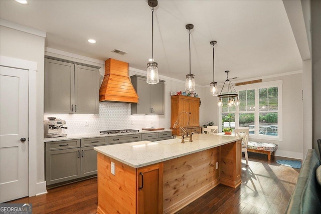 1069 Dean Hill Rd, Monroe, GA 30655 - kitchen featuring gray cabinetry, premium range hood, a sink, dark wood finished floors, and light stone counters