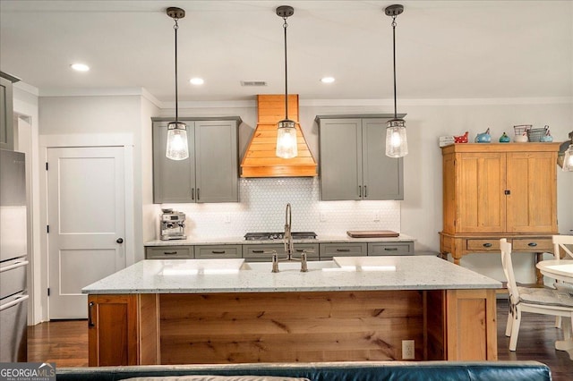 1069 Dean Hill Rd, Monroe, GA 30655 - kitchen featuring premium range hood, crown molding, gray cabinets, backsplash, and dark wood-type flooring