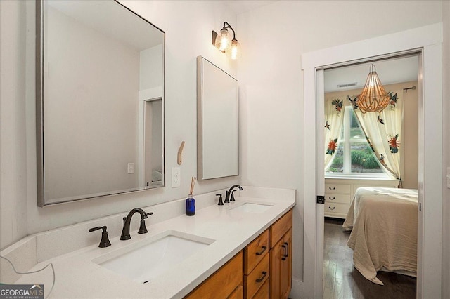 1069 Dean Hill Rd, Monroe, GA 30655 - full bathroom with ensuite bathroom, double vanity, and wood finished floors