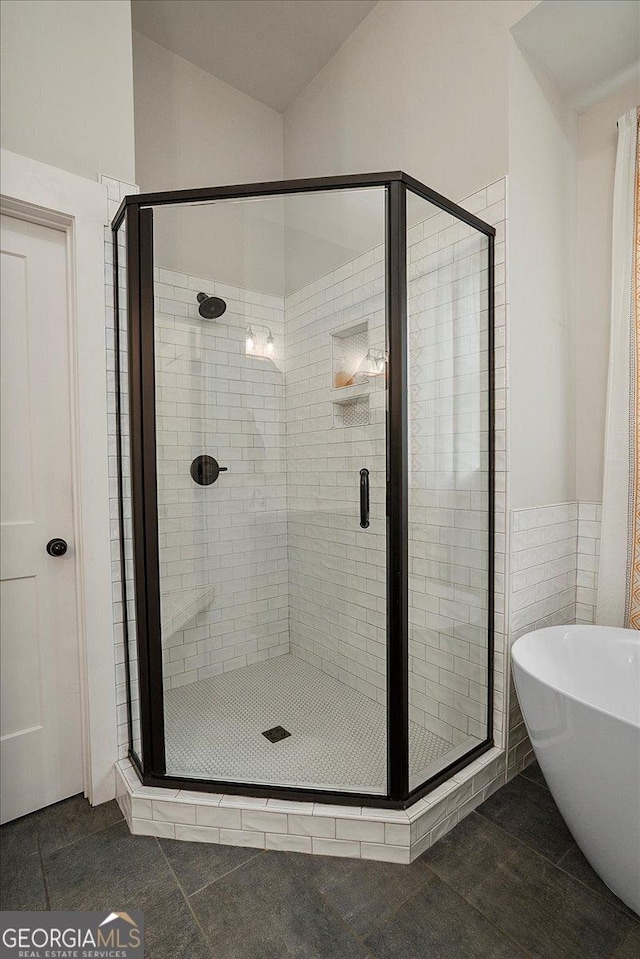 1069 Dean Hill Rd, Monroe, GA 30655 - full bathroom with a shower stall and a freestanding tub