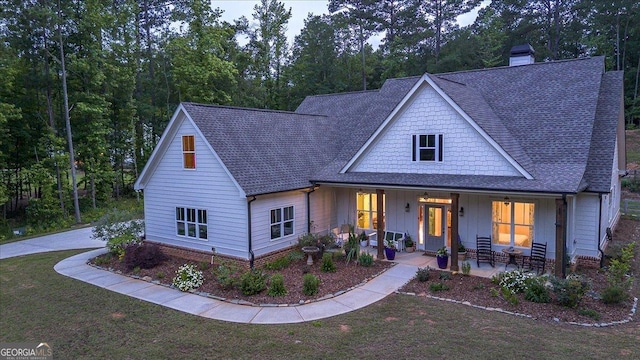 1069 Dean Hill Rd, Monroe, GA 30655 - view of front facade featuring roof with shingles, a chimney, a front lawn, and board and batten siding