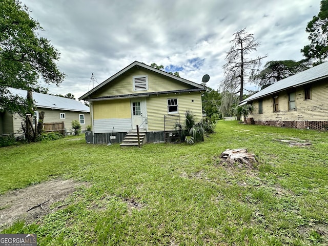 310 Butler St, Waycross, GA 31501 - back of house with entry steps and a lawn