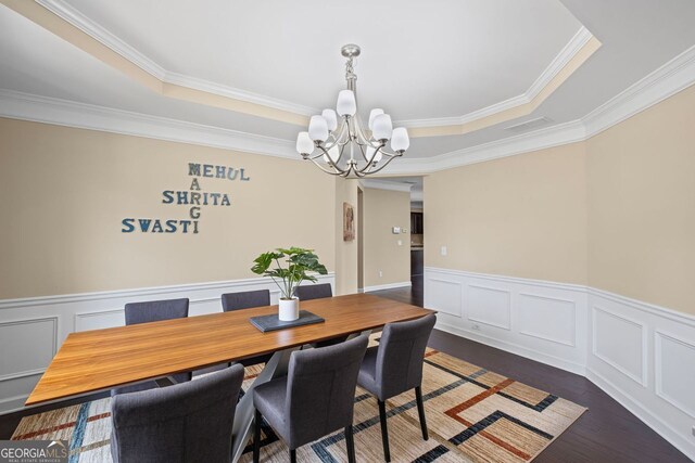 745 Newfield Ln, Alpharetta, GA 30004 - dining space with a chandelier, ornamental molding, a tray ceiling, wood finished floors, and wainscoting