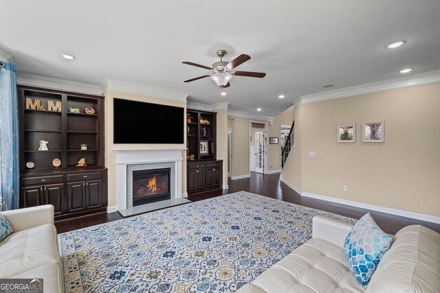 745 Newfield Ln, Alpharetta, GA 30004 - living area with dark wood-style flooring, ceiling fan, a premium fireplace, ornamental molding, and recessed lighting