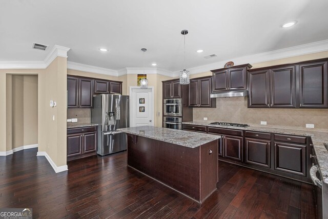 745 Newfield Ln, Alpharetta, GA 30004 - kitchen with stainless steel appliances, a center island, under cabinet range hood, dark wood-style floors, and dark brown cabinets