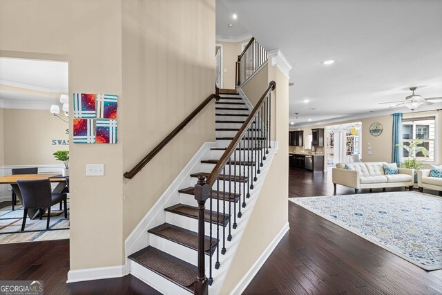 745 Newfield Ln, Alpharetta, GA 30004 - stairs featuring ornamental molding, wood-type flooring, recessed lighting, ceiling fan, and a chandelier