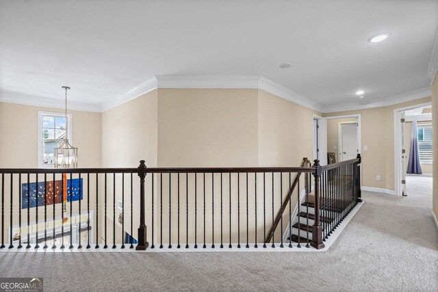 745 Newfield Ln, Alpharetta, GA 30004 - hall featuring carpet, an upstairs landing, a chandelier, crown molding, and recessed lighting