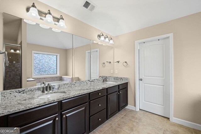 745 Newfield Ln, Alpharetta, GA 30004 - full bathroom featuring double vanity, a shower stall, tile patterned flooring, and a bathtub