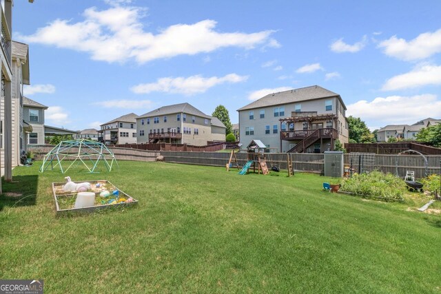 745 Newfield Ln, Alpharetta, GA 30004 - fenced backyard featuring a playground and a residential view