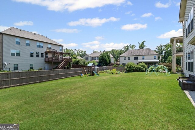 745 Newfield Ln, Alpharetta, GA 30004 - fenced backyard with a playground and a residential view